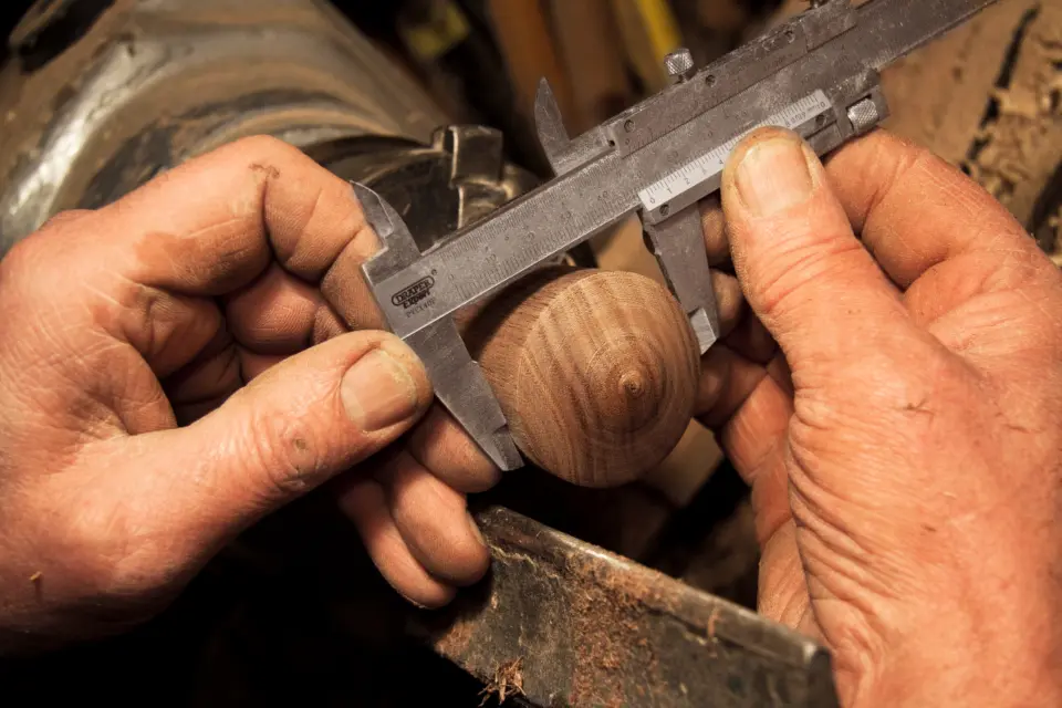 Hands at a workbench restoring a vintage find
